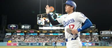 Los Angeles Dodgers designated hitter Shohei Ohtani (17) returns to the dugout after scoring in the seventh inning against the Colorado Rockies at Dodger Stadium