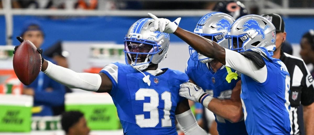Detroit Lions safety Kerby Joseph (31) celebrates with teammates after inception against the Chicago Bears during the second quarter of the game at Ford Field