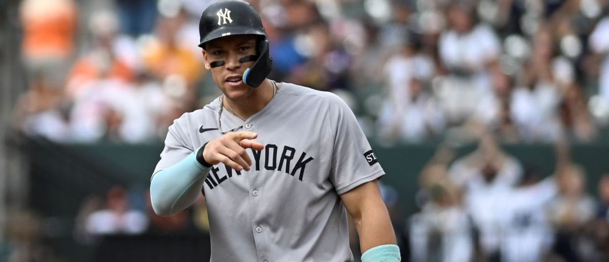 New York Yankees designated hitter Aaron Judge (99) reacts after New York Yankees first base Ben Rice (not pictured) sixth inning rbi single from second base against the Baltimore Orioles at Oriole Park at Camden Yards.