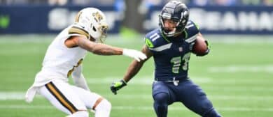 Seattle Seahawks wide receiver Jaxon Smith-Njigba (11) carries the ball after a catch against the New Orleans Saints in the first quarter at Lumen Field.