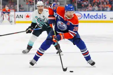 Sep 24, 2025; Edmonton, Alberta, CAN; Edmonton Oilers forward Leon Draisaitl (29) looks to make a pass in front of Seattle Kraken forward Jordan Eberle (7) during the third period at Rogers Place.