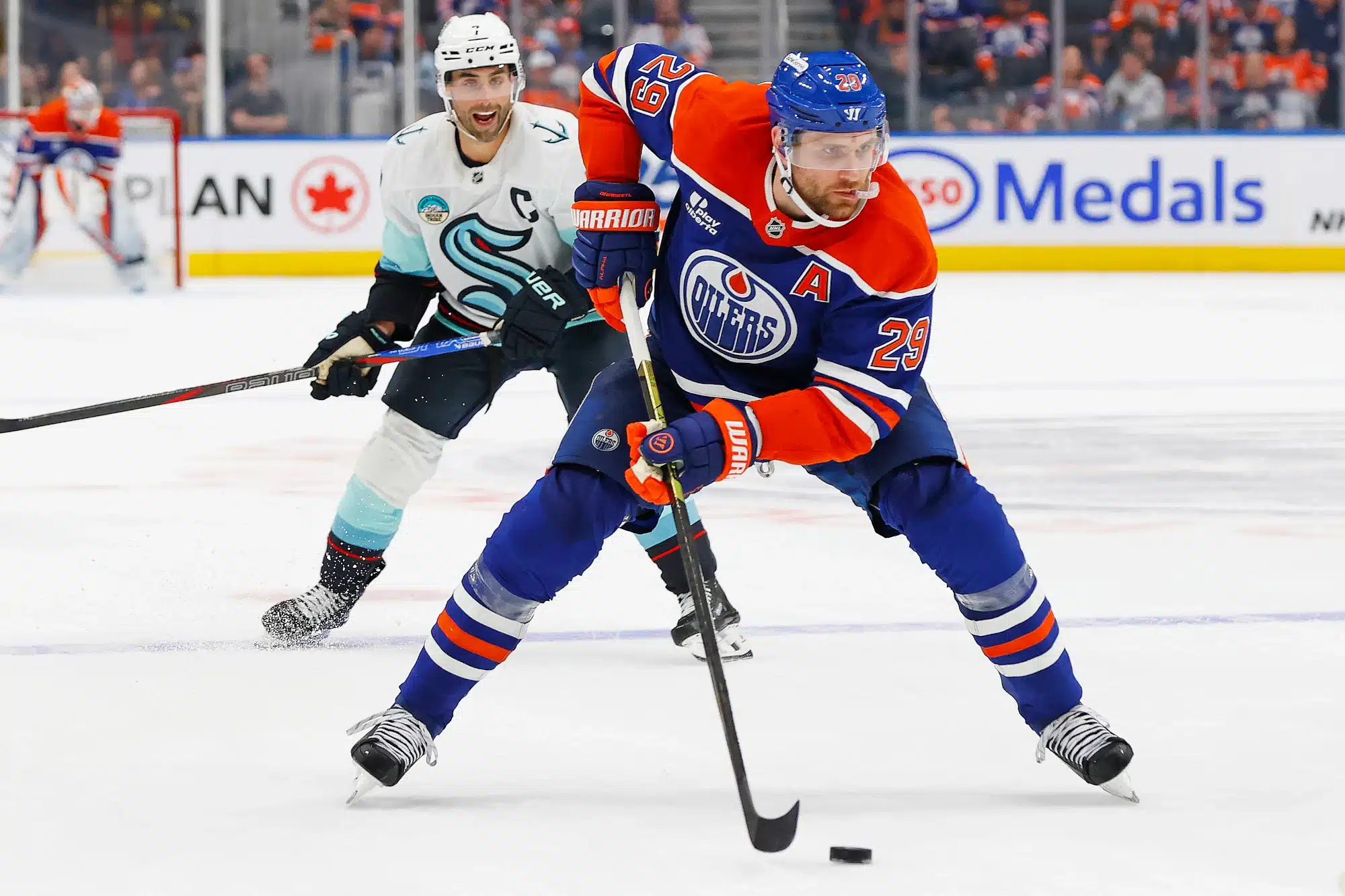 Sep 24, 2025; Edmonton, Alberta, CAN; Edmonton Oilers forward Leon Draisaitl (29) looks to make a pass in front of Seattle Kraken forward Jordan Eberle (7) during the third period at Rogers Place.