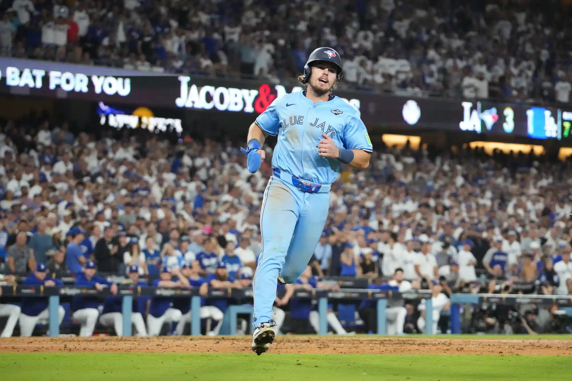 Oct 29, 2025; Los Angeles, California, USA; Toronto Blue Jays right fielder Addison Barger (47) scores on a wild pitch during the seventh inning against the Los Angeles Dodgers during game five of the 2025 MLB World Series at Dodger Stadium.