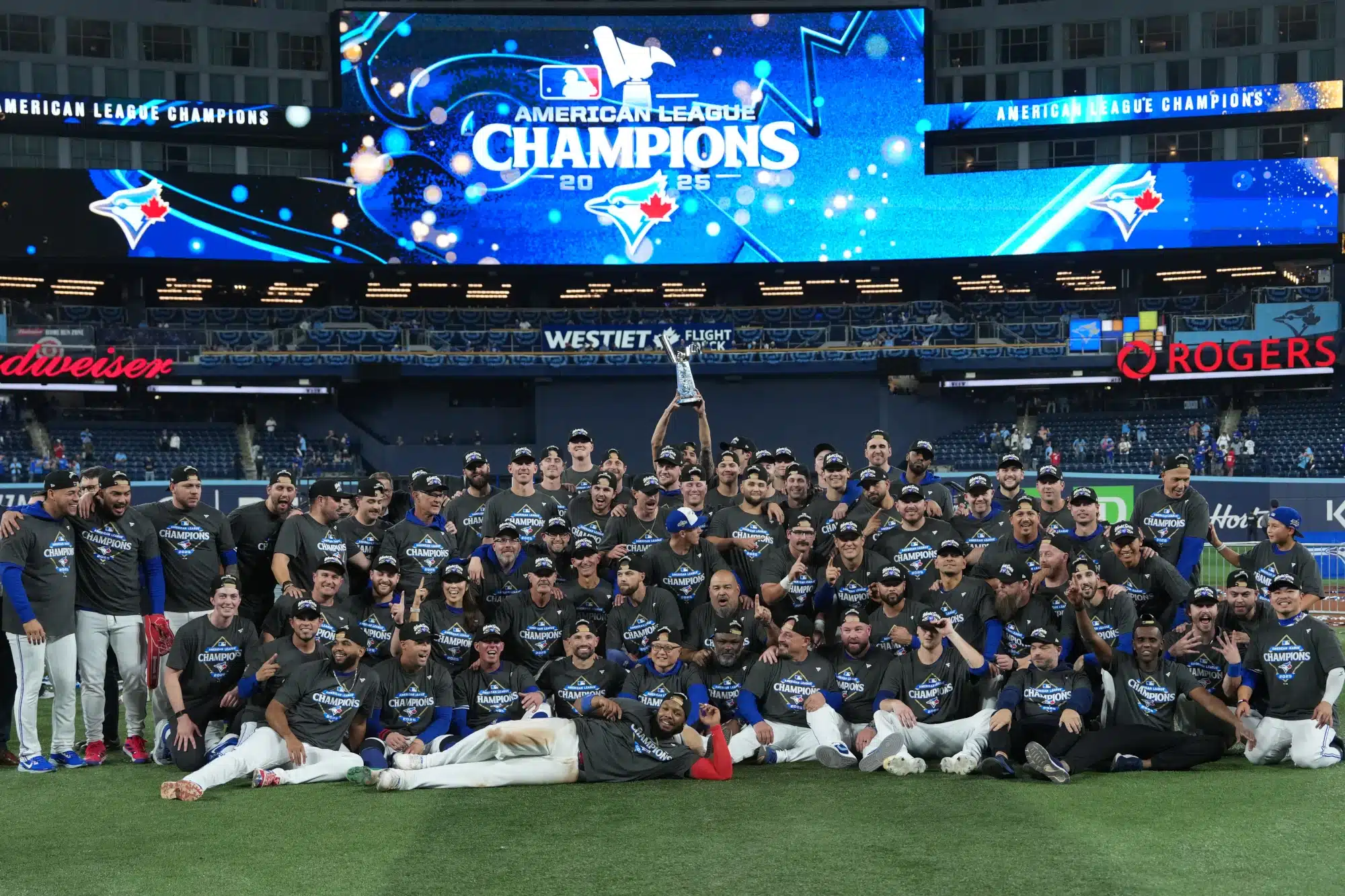 The Toronto Blue Jays take a team photo on the field of the Rogers Centre after winning game 7 of the ALCS.