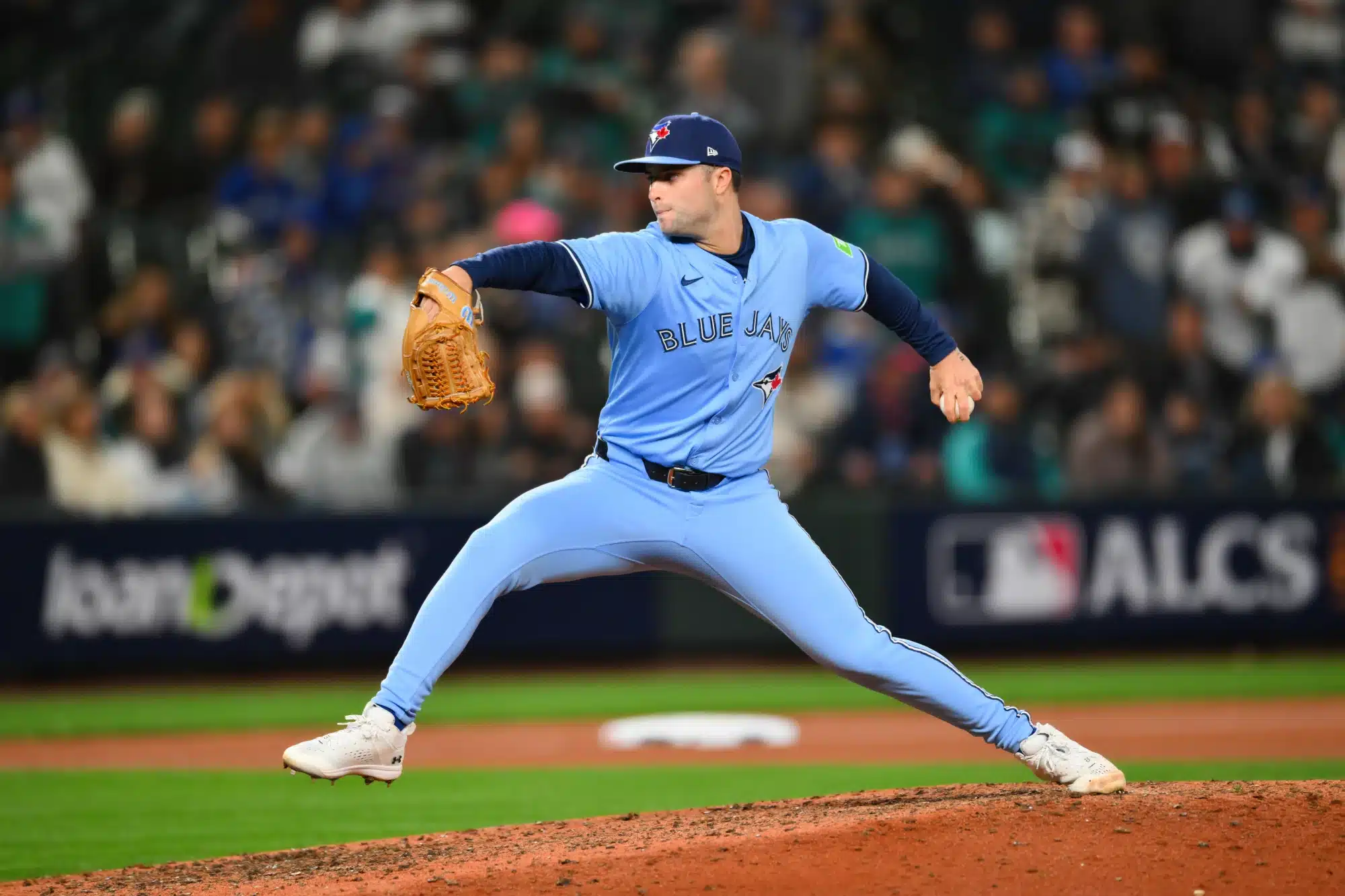 Oct 15, 2025; Seattle, Washington, USA; Toronto Blue Jays pitcher Mason Fluharty (68) pitches during the ninth inning against the Seattle Mariners during game three of the ALCS round for the 2025 MLB playoffs at T-Mobile Park.