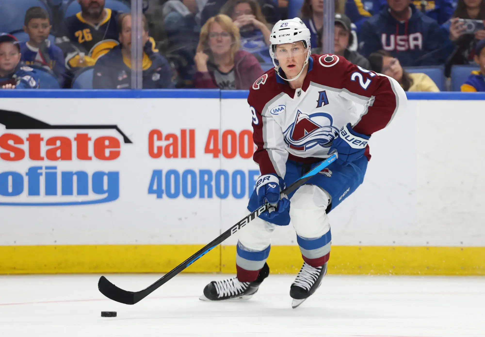 Oct 13, 2025; Buffalo, New York, USA; Colorado Avalanche center Nathan MacKinnon (29) looks to make a pass during the third period against the Buffalo Sabres at KeyBank Center.