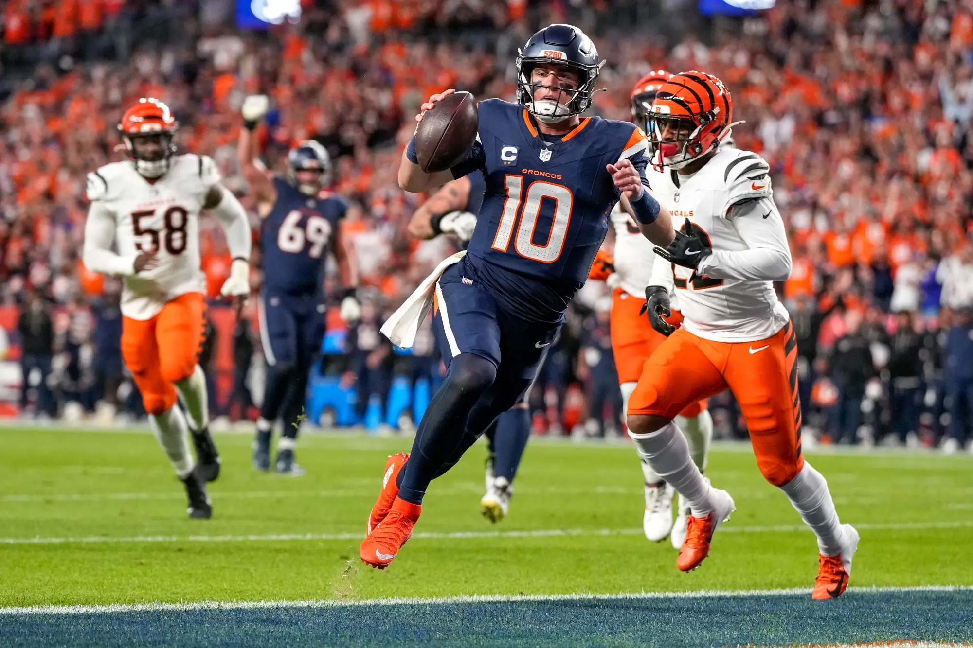 Denver Broncos quarterback Bo Nix (10) runs into the end zone for a touchdown in the first quarter of the NFL Week 4 Monday Night Football game between the Denver Broncos and the Cincinnati Bengals at Empower Field at Mile High in Denver on Monday, Sept. 29, 2025.