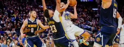 Oct 23, 2025; San Francisco, California, USA; Golden State Warriors guard Stephen Curry (30) puts up a shot over Denver Nuggets forward Cameron Johnson (23) during the fourth quarter at Chase Center.