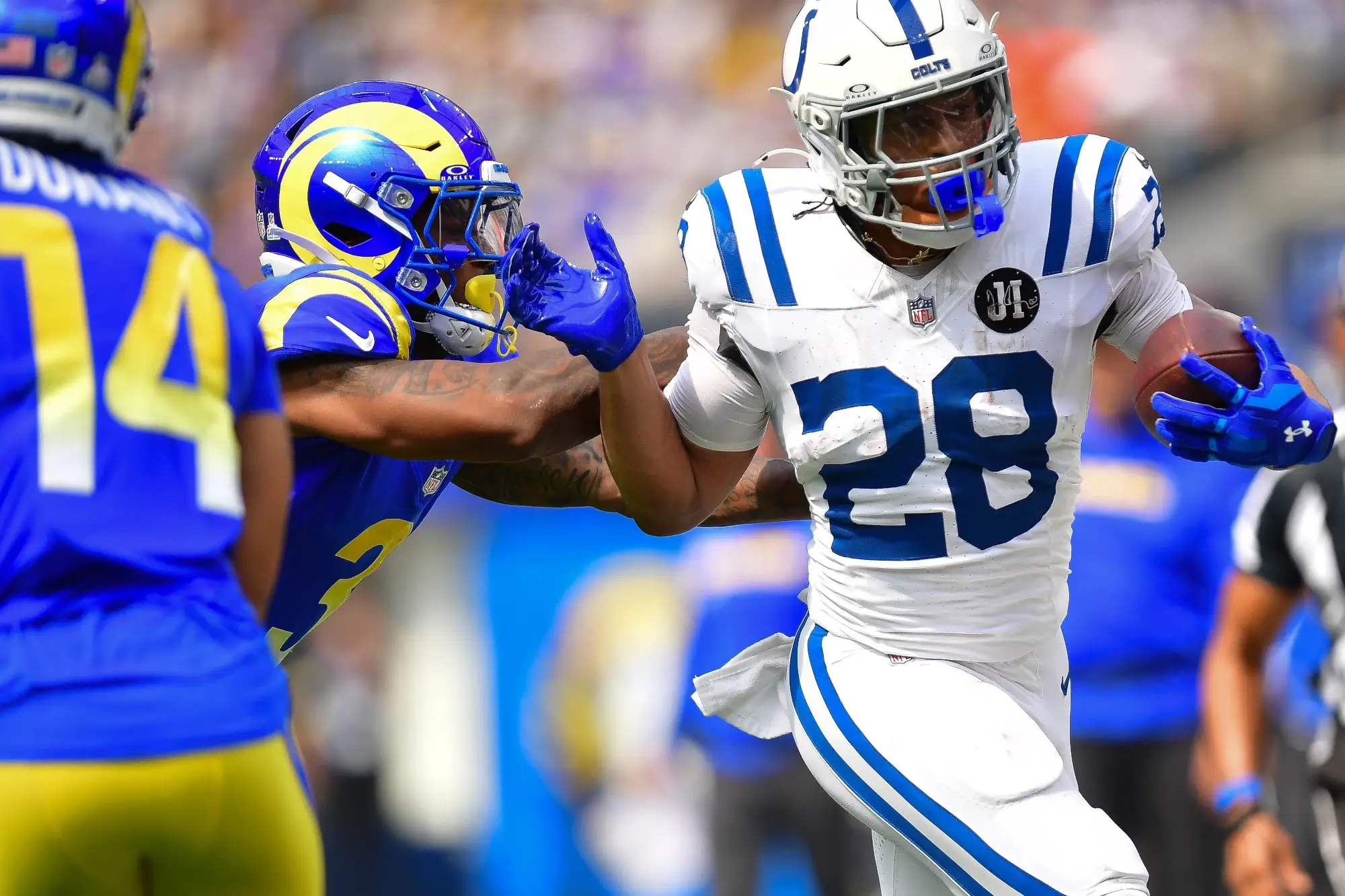 Sep 28, 2025; Inglewood, California, USA; Indianapolis Colts running back Jonathan Taylor (28) is pushed out of bounds by Los Angeles Rams safety Kam Curl (3) during the first half at SoFi Stadium.