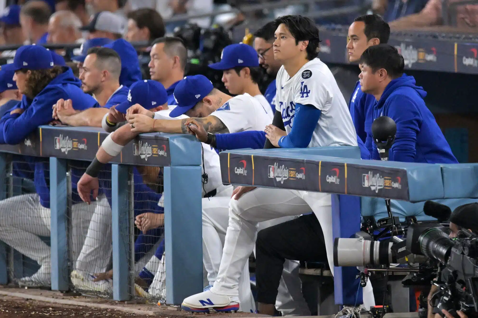 Oct 29, 2025; Los Angeles, California, USA; Los Angeles Dodgers two-way player Shohei Ohtani (17) looks on from the dugout in the ninth inning against the Toronto Blue Jays during game five of the 2025 MLB World Series at Dodger Stadium.