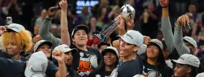 Oct 10, 2025; Phoenix, Arizona, USA; Las Vegas Aces center A'ja Wilson (22) celebrates with teammates after game four of the 2025 WNBA Finals at Mortgage Matchup Center.