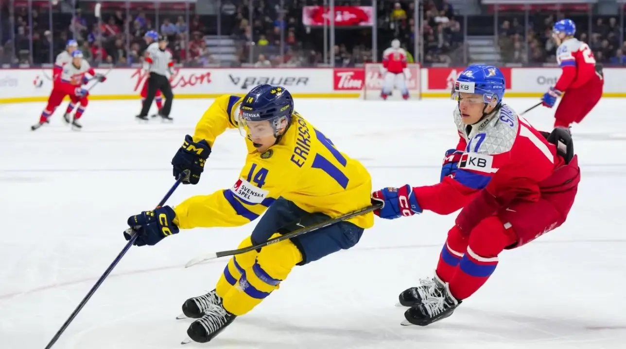 Linus Eriksson #14 of Sweden controls the puck against Petr Sikora #17 of Czechia in Bronze Medal Game action at the 2025 IIHF World Junior Championship at Canadian Tire Centre on January 5, 2025 in Kanata, Ontario, Canada.
