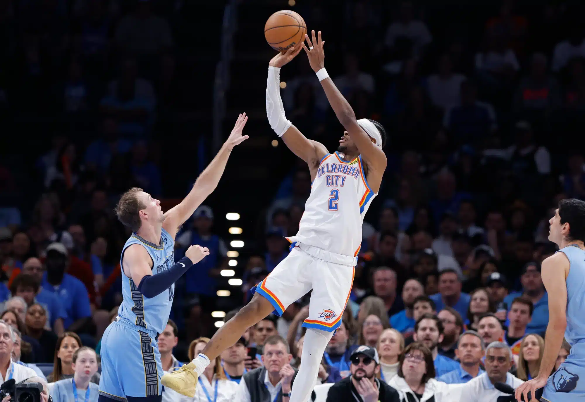 Mar 27, 2025; Oklahoma City, Oklahoma, USA; Oklahoma City Thunder guard Shai Gilgeous-Alexander (2) shoots over Memphis Grizzlies guard Luke Kennard (10) during the second half at Paycom Center. 