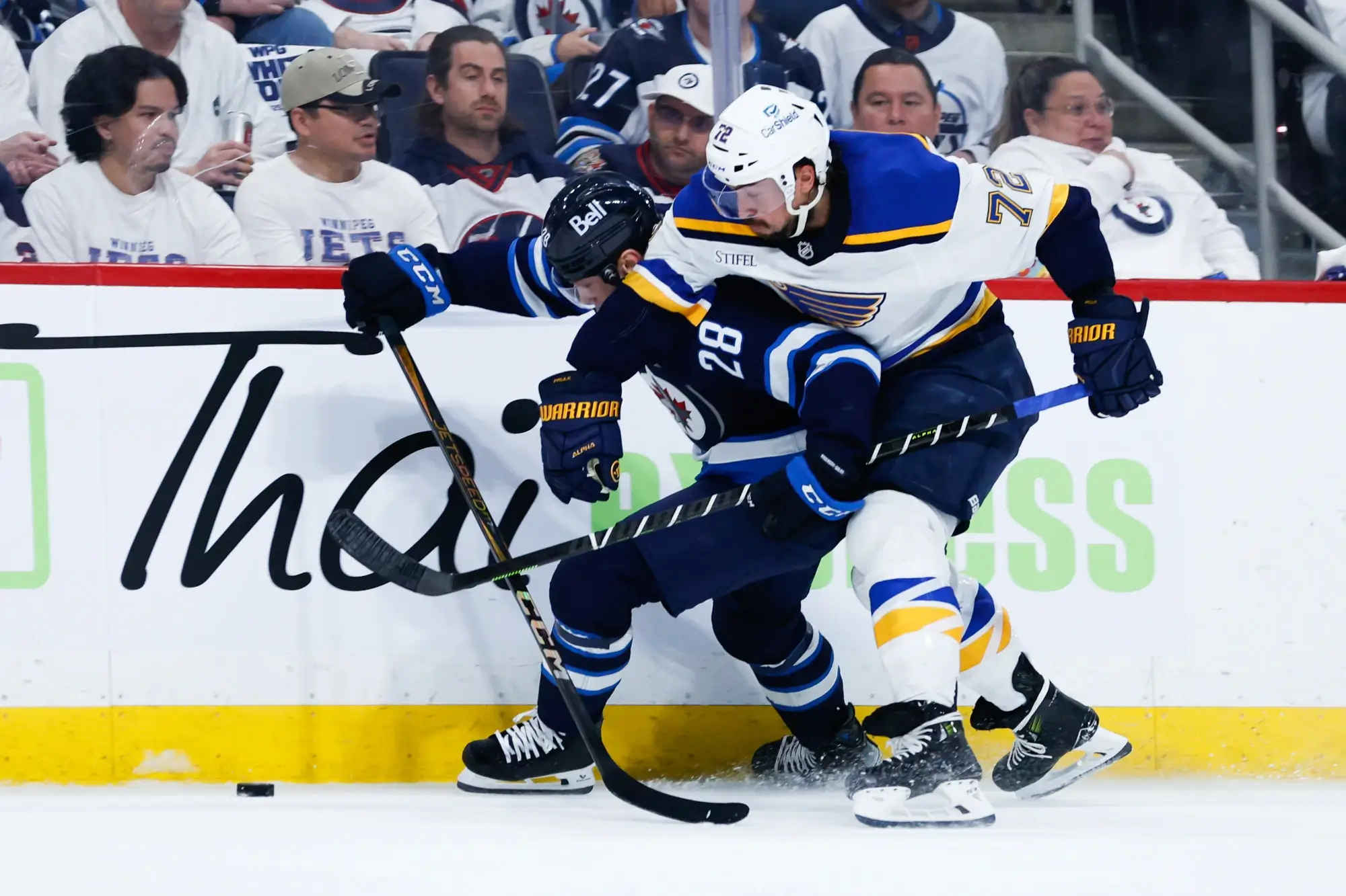 Apr 30, 2025; Winnipeg, Manitoba, CAN; St. Louis Blues defenseman Justin Faulk (72) checks Winnipeg Jets forward Jaret Anderson-Dolan (28) during the second period in game five of the first round of the 2025 Stanley Cup Playoffs at Canada Life Centre.