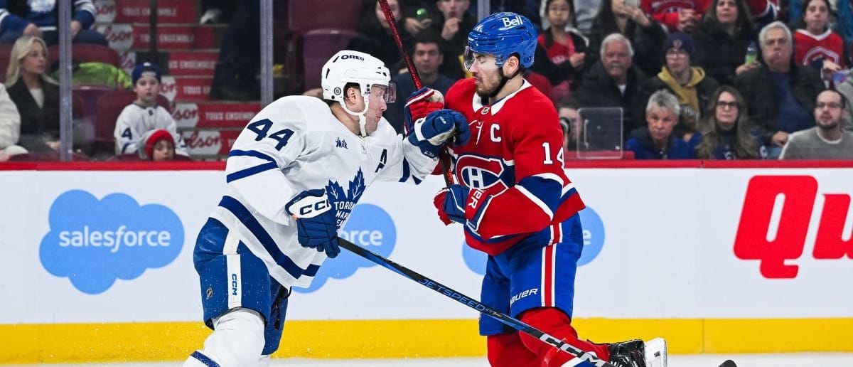 Toronto Maple Leafs defenseman Morgan Rielly (44) defends agains tMontreal Canadiens center Nick Suzuki (14) during the second period at Bell Centre.
