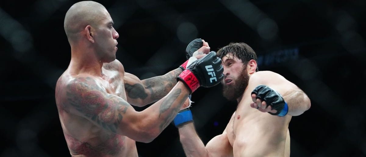 Alex Pereira (red gloves) fights Magomed Ankalaev (blue gloves) during UFC 313 at T-Mobile Arena