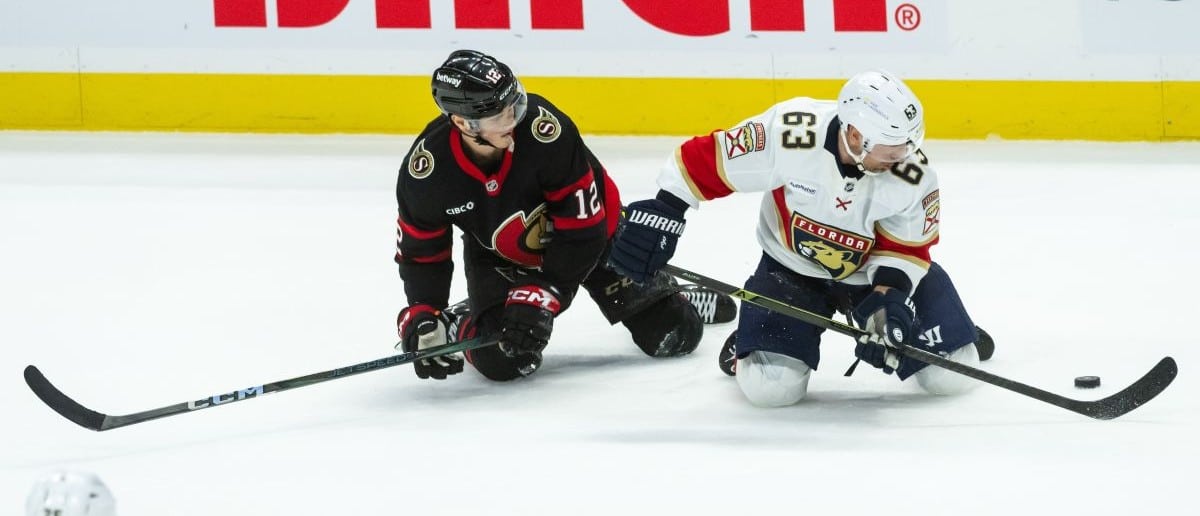 Ottawa Senators center Shane Pinto (12) and Florida Panthers center Brad Marchand (63) follow while battling for the puck in the third period at the Canadian Tire Centre