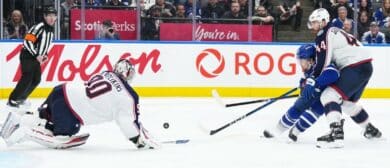 Toronto Maple Leafs left wing Nicholas Robertson (89) battles for the puck with Columbus Blue Jackets defenseman Erik Gudbranson (44) during the third period at Scotiabank Arena.