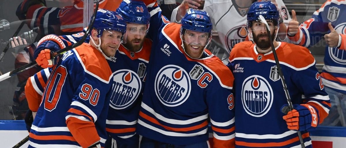 Edmonton Oilers center Leon Draisaitl (29) reacts with center Connor McDavid (97) and defenseman Evan Bouchard (2) after scoring a goal against the Florida Panthers during the first period in game two of the 2025 Stanley Cup Final at Rogers Place