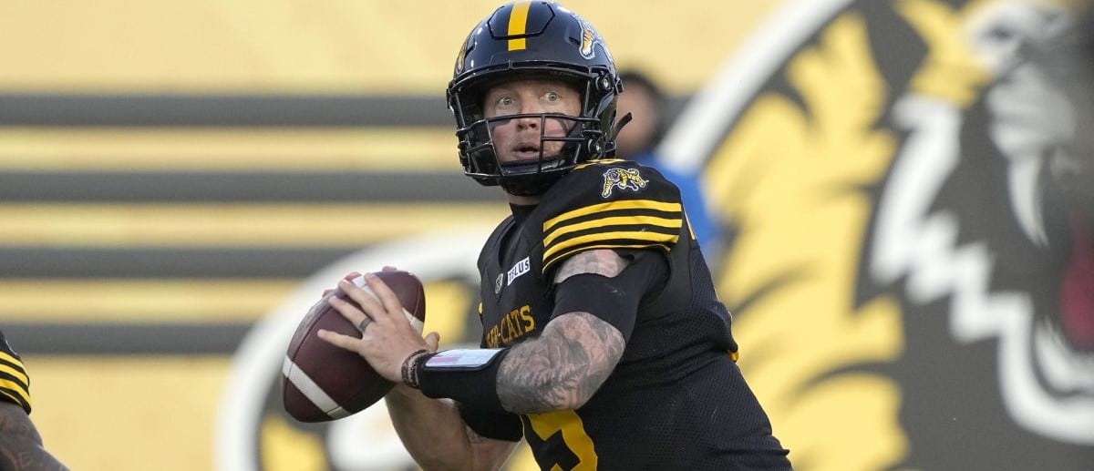 Hamilton Tiger-Cats quarterback Bo Levi Mitchell (19) passes the football against the Saskatchewan Roughriders during the second half at Hamilton Stadium.
