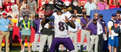 Baltimore Ravens quarterback Lamar Jackson (8) throws a pass against the Kansas City Chiefs during the game at GEHA Field at Arrowhead Stadium.