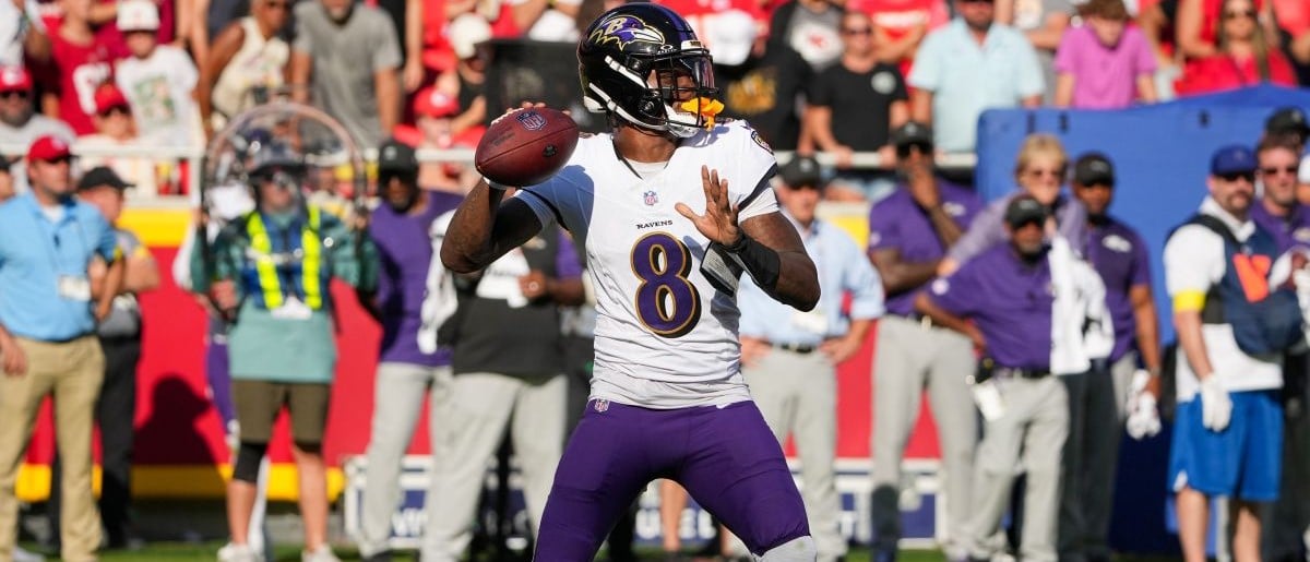 Baltimore Ravens quarterback Lamar Jackson (8) throws a pass against the Kansas City Chiefs during the game at GEHA Field at Arrowhead Stadium.