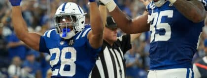 Indianapolis Colts running back Jonathan Taylor (28) and tight end Andrew Ogletree (85) react after Taylor scores a touchdown against the Las Vegas Raiders on Sunday, Oct. 5, 2025, during a game at Lucas Oil Stadium in Indianapolis. The Colts defeated the Raiders 40-6.