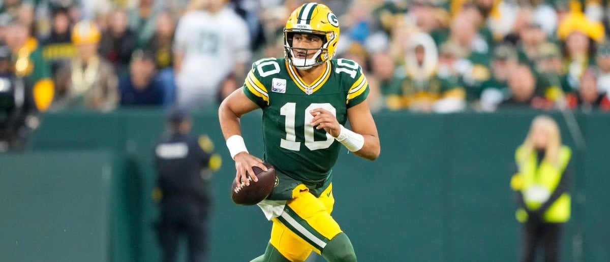 Green Bay Packers quarterback Jordan Love (10) scrambles outside of the pocket in the fourth quarter against the Cincinnati Bengals at Lambeau Field