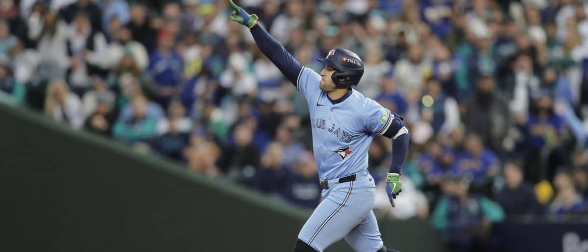 Toronto Blue Jays designated hitter George Springer (4) celebrates after hitting a home run in the third inning against the Seattle Mariners during game three of the ALCS round for the 2025 MLB playoffs at T-Mobile Park