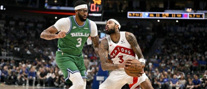 Toronto Raptors forward Brandon Ingram (3) looks to move the ball past Dallas Mavericks forward Anthony Davis (3) during the first quarter at the American Airlines Center.