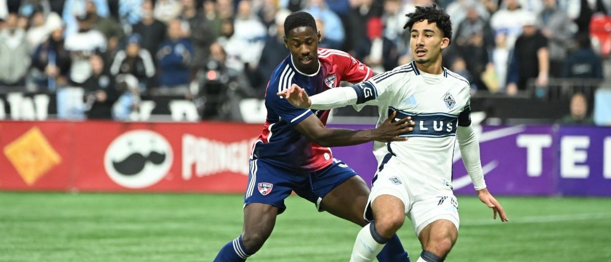 FC Dallas defender Osaze Urhoghide (3) battles for the ball against Vancouver Whitecaps FC forward Rayan Elloumi (75) during the second half at BC Place