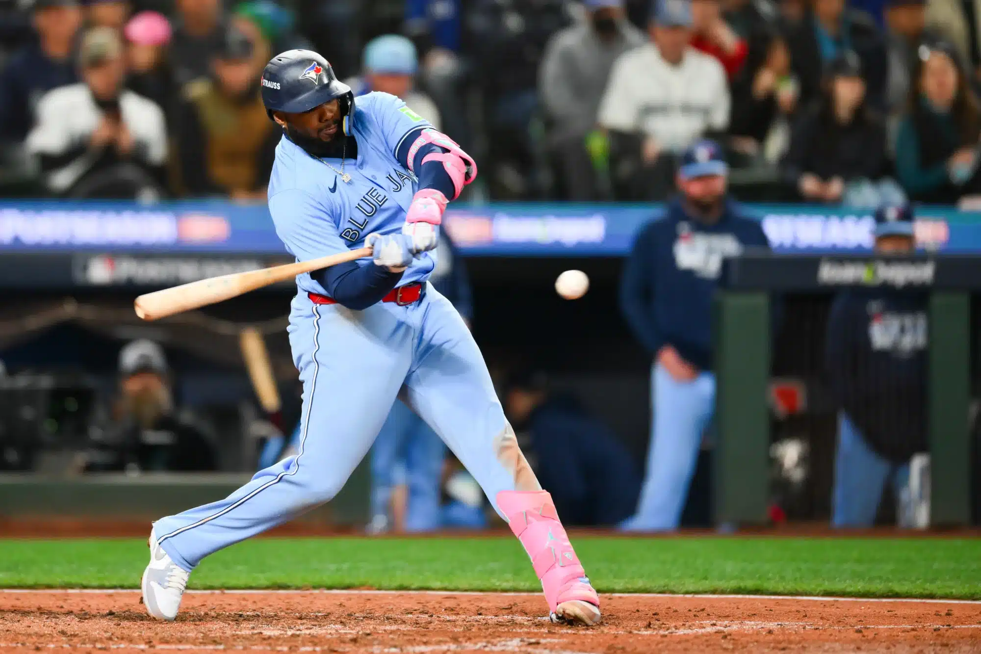 Oct 15, 2025; Seattle, Washington, USA; Toronto Blue Jays first baseman Vladimir Guerrero Jr. (27) hits a double during the eighth inning against the Seattle Mariners during game three of the ALCS round for the 2025 MLB playoffs at T-Mobile Park.