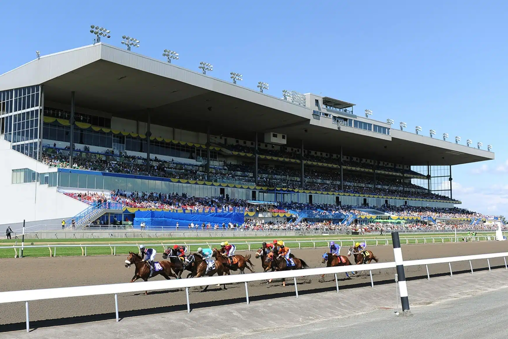 A view of the grand stand of Woodbine Racetrack on a sunny day