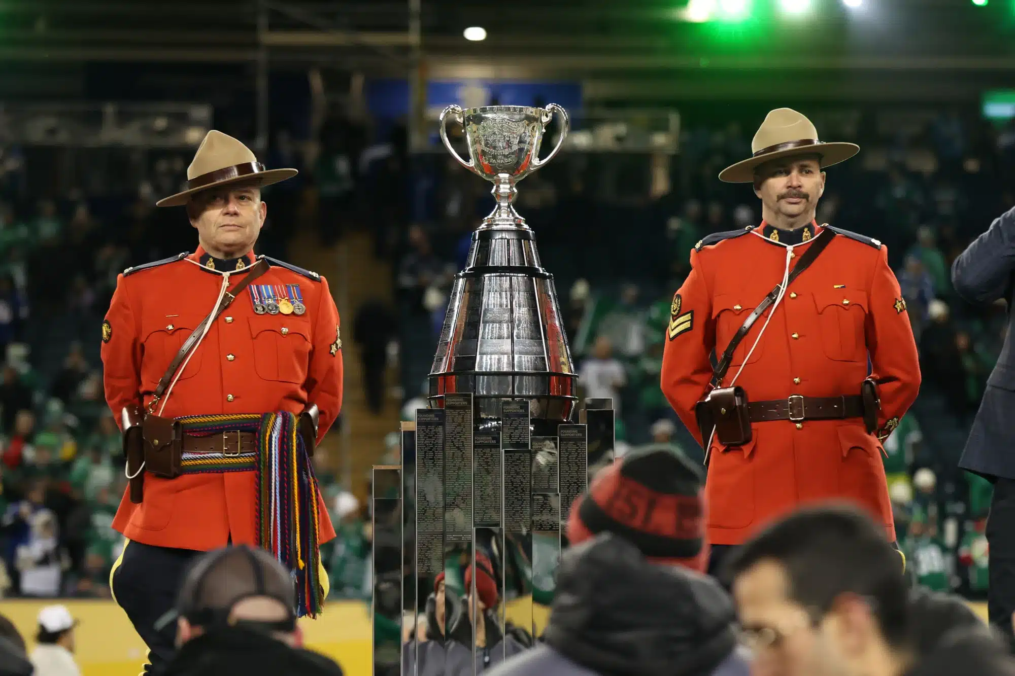 Nov 16, 2025; Winnipeg, Manitoba, Canada; Canadian Royal Mounted Police stand next to the Grey Cup before it is presented to the Saskatchewan Roughriders for the win against the Montreal Alouettes during the 112th Grey Cup Championship at Princess Auto Stadium.