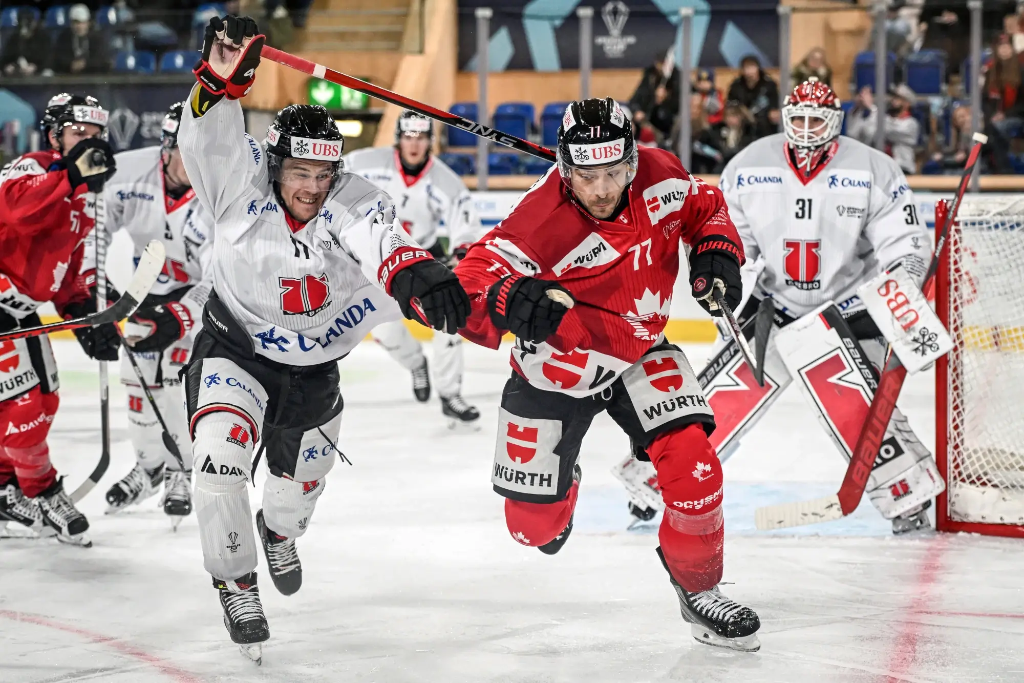 A Team Canada skater competes with a skater from Sweden's Orebro at the 2024 Spengler Cup. Canada left the tournament without a win.