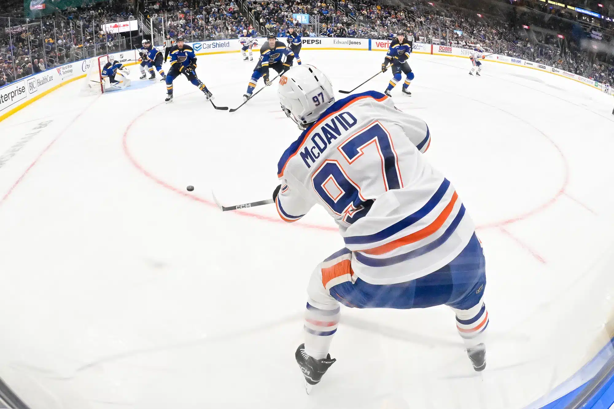 Nov 3, 2025; St. Louis, Missouri, USA; Edmonton Oilers center Connor McDavid (97) passes the puck against the St. Louis Blues during the third period at Enterprise Center.
