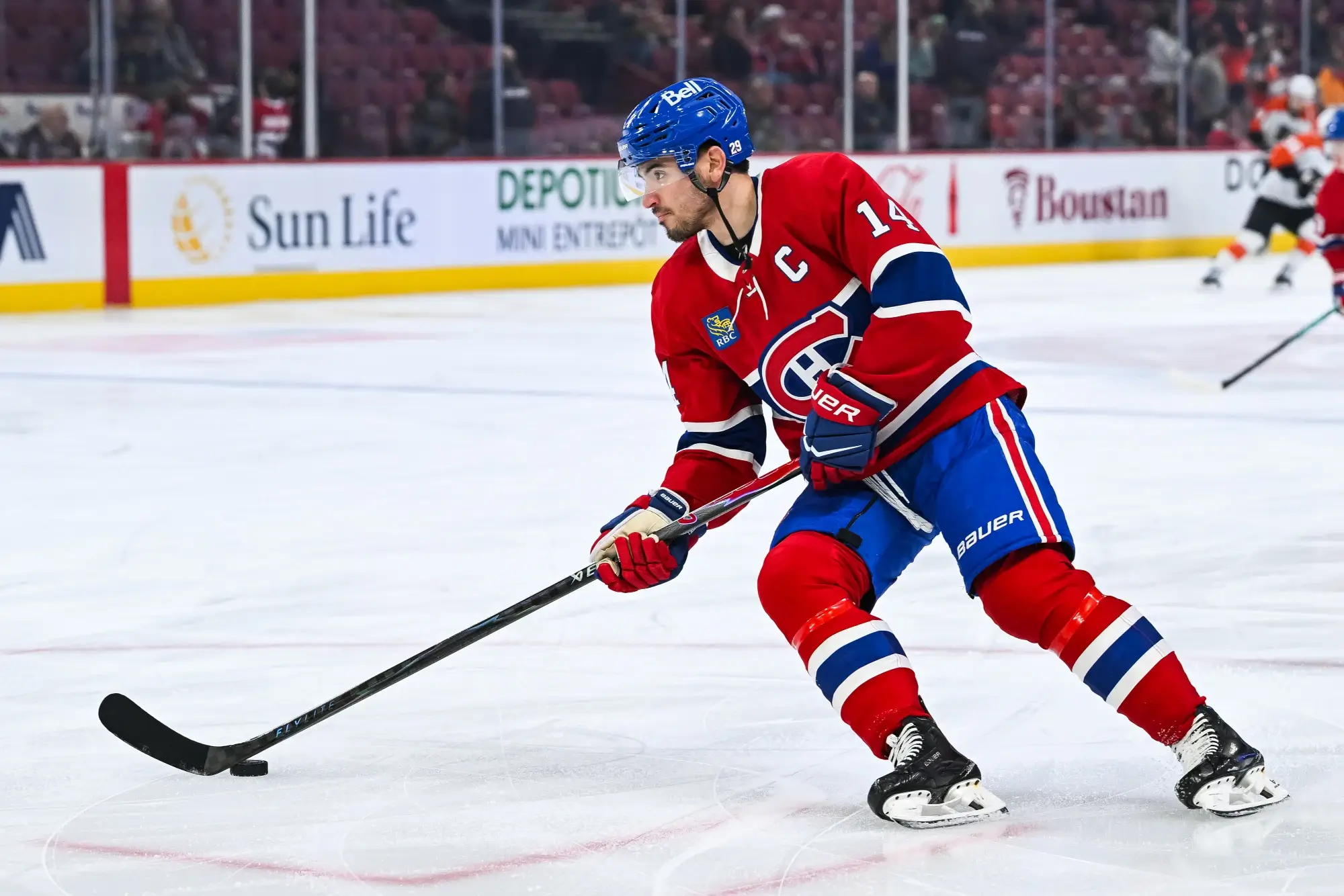 Nov 4, 2025; Montreal, Quebec, CAN; Montreal Canadiens center Nick Suzuki (14) skates with a puck during warm-up before the game against the Philadelphia Flyers at Bell Centre.