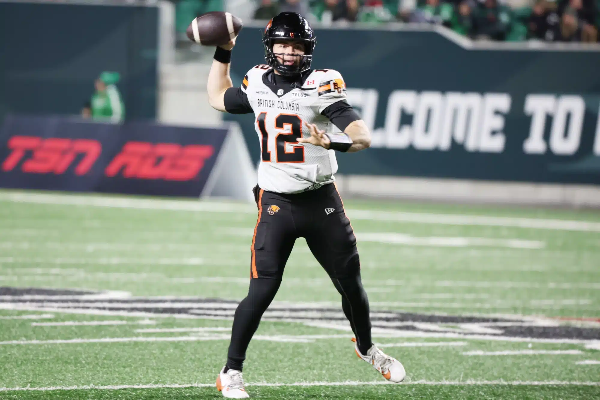 Nov 8, 2025; Regina, Saskatchewan, Canada; BC Lions quarterback Nathan Rourke (12) looks for a receiver downfield during the second half of the CFL Western Conference Final between the BC Lions and the Saskatchewan Roughriders at Mosaic Stadium.
