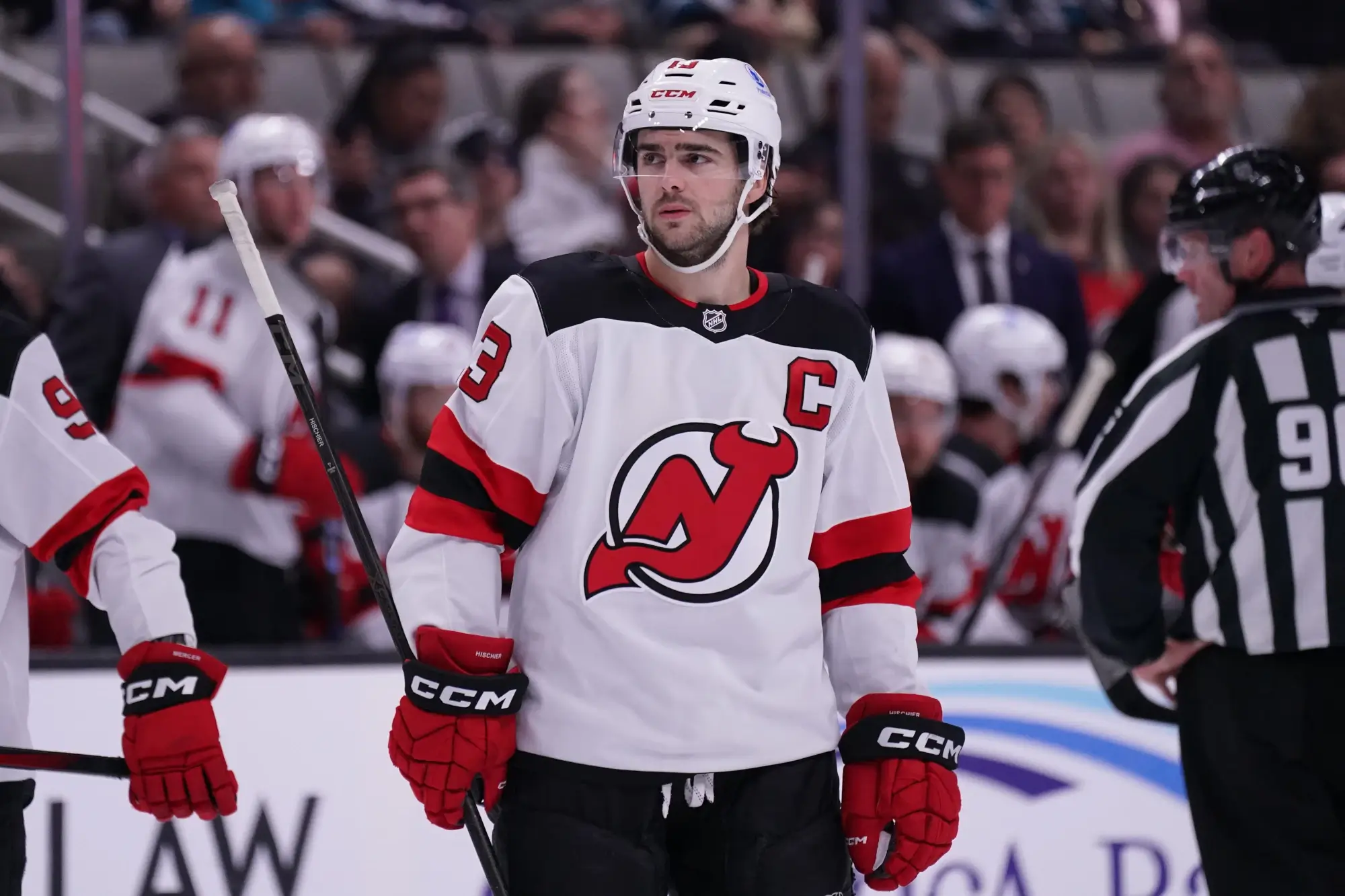 Oct 30, 2025; San Jose, California, USA; New Jersey Devils center Nico Hischier (13) waits for play to resume against the San Jose Sharks in the first period at SAP Center at San Jose.