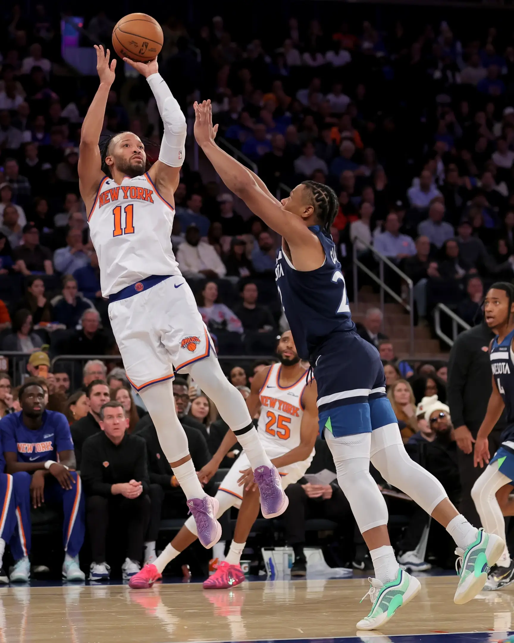 Nov 5, 2025; New York, New York, USA; New York Knicks guard Jalen Brunson (11) takes a shot against Minnesota Timberwolves guard Jaylen Clark (22) during the fourth quarter at Madison Square Garden.