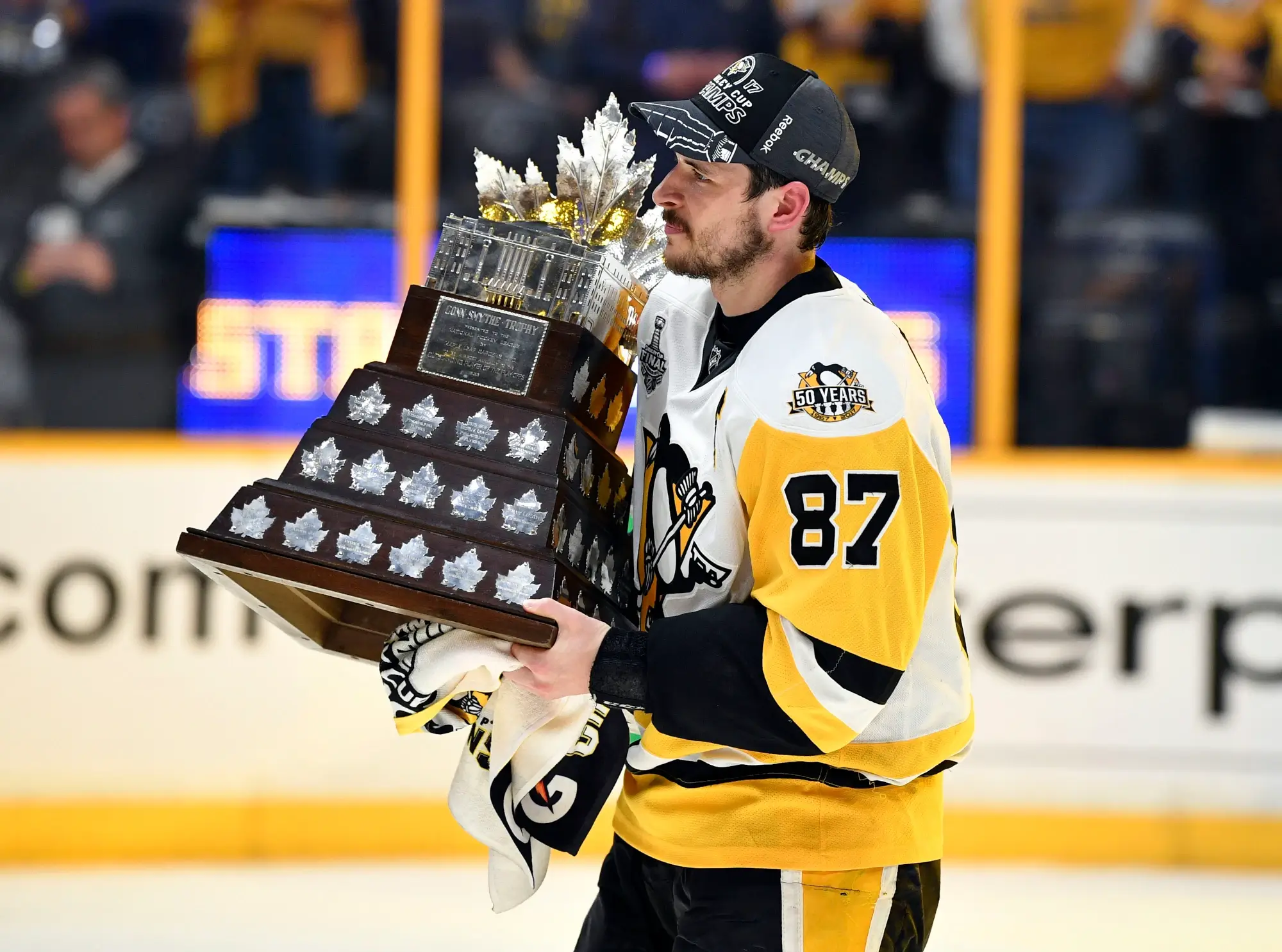Jun 11, 2017; Nashville, TN, USA; Pittsburgh Penguins center Sidney Crosby (87) is presented with the Conn Smythe Trophy after defeating the Nashville Predators in game six of the 2017 Stanley Cup Final at Bridgestone Arena.
