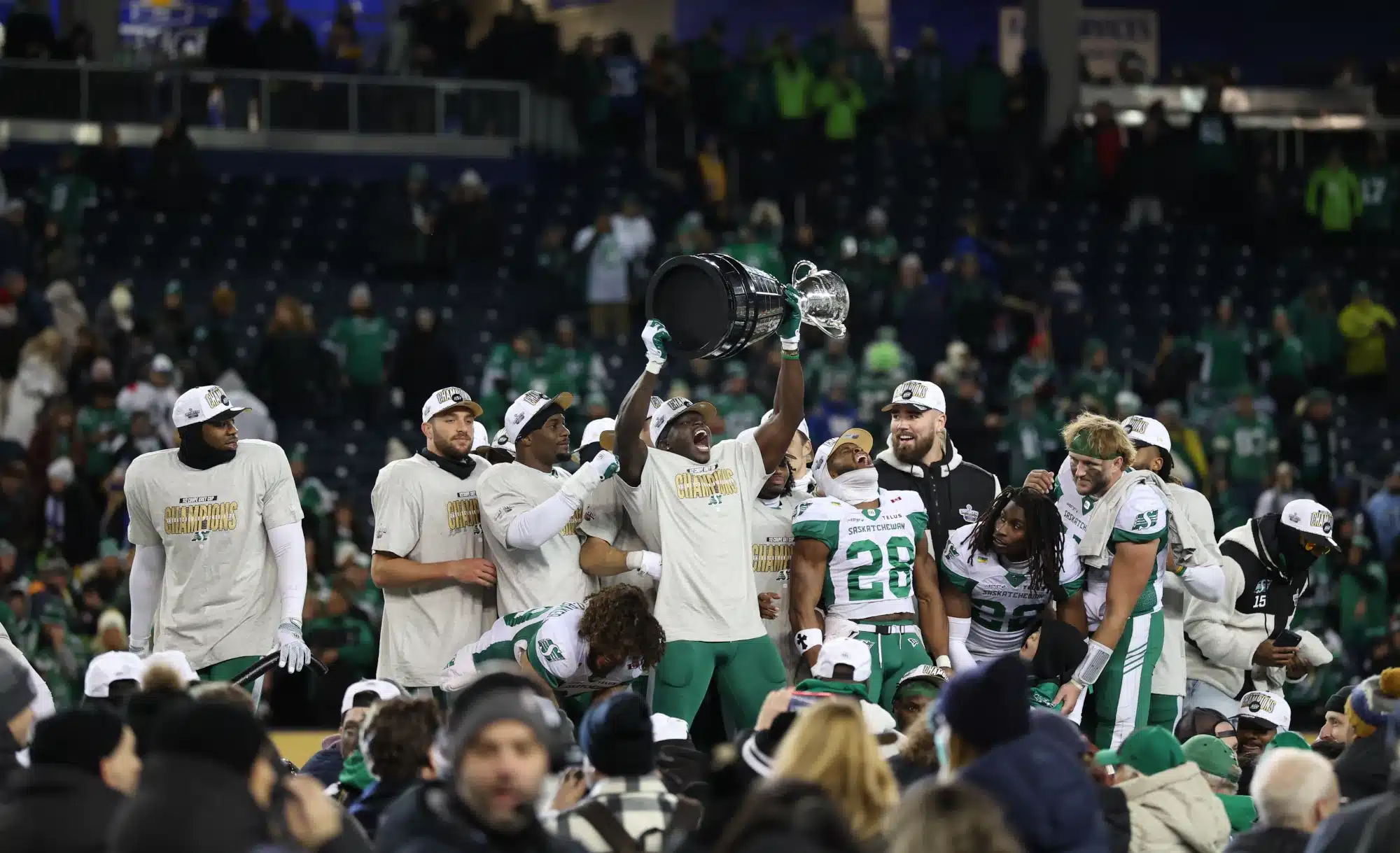 Nov 16, 2025; Winnipeg, Manitoba, Canada; The Saskatchewan Roughriders celebrate the win hoisting the Grey Cup after defeating Montreal Alouettes during the 112th Grey Cup Championship at Princess Auto Stadium.