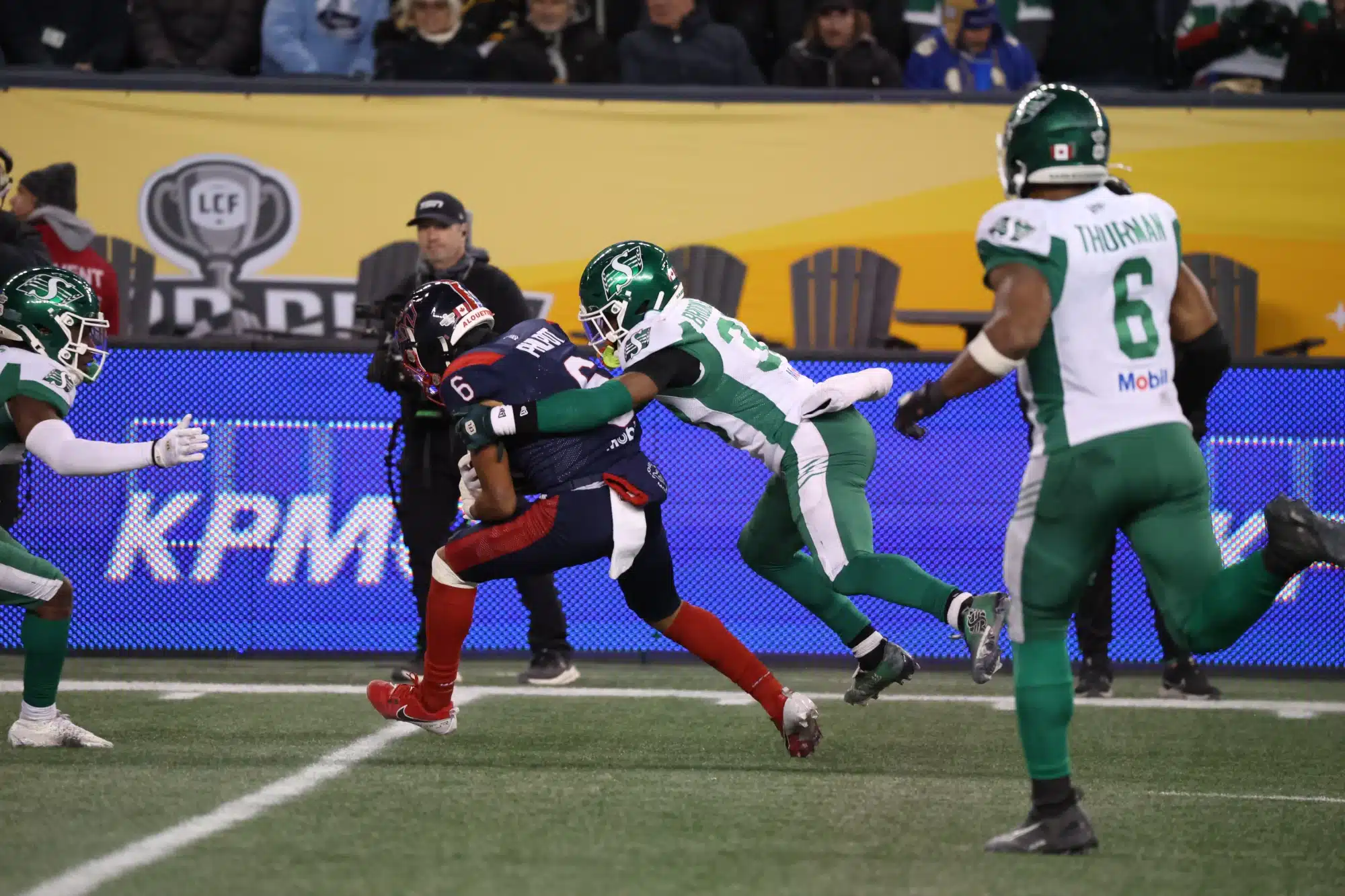 Nov 16, 2025; Winnipeg, Manitoba, Canada; Montreal Alouettes wide receiver Tyson Philpot (6) is tackled by Saskatchewan Roughriders defensive back Antoine Brooks Jr. (33) during the third quarter during the 112th Grey Cup Championship at Princess Auto Stadium.