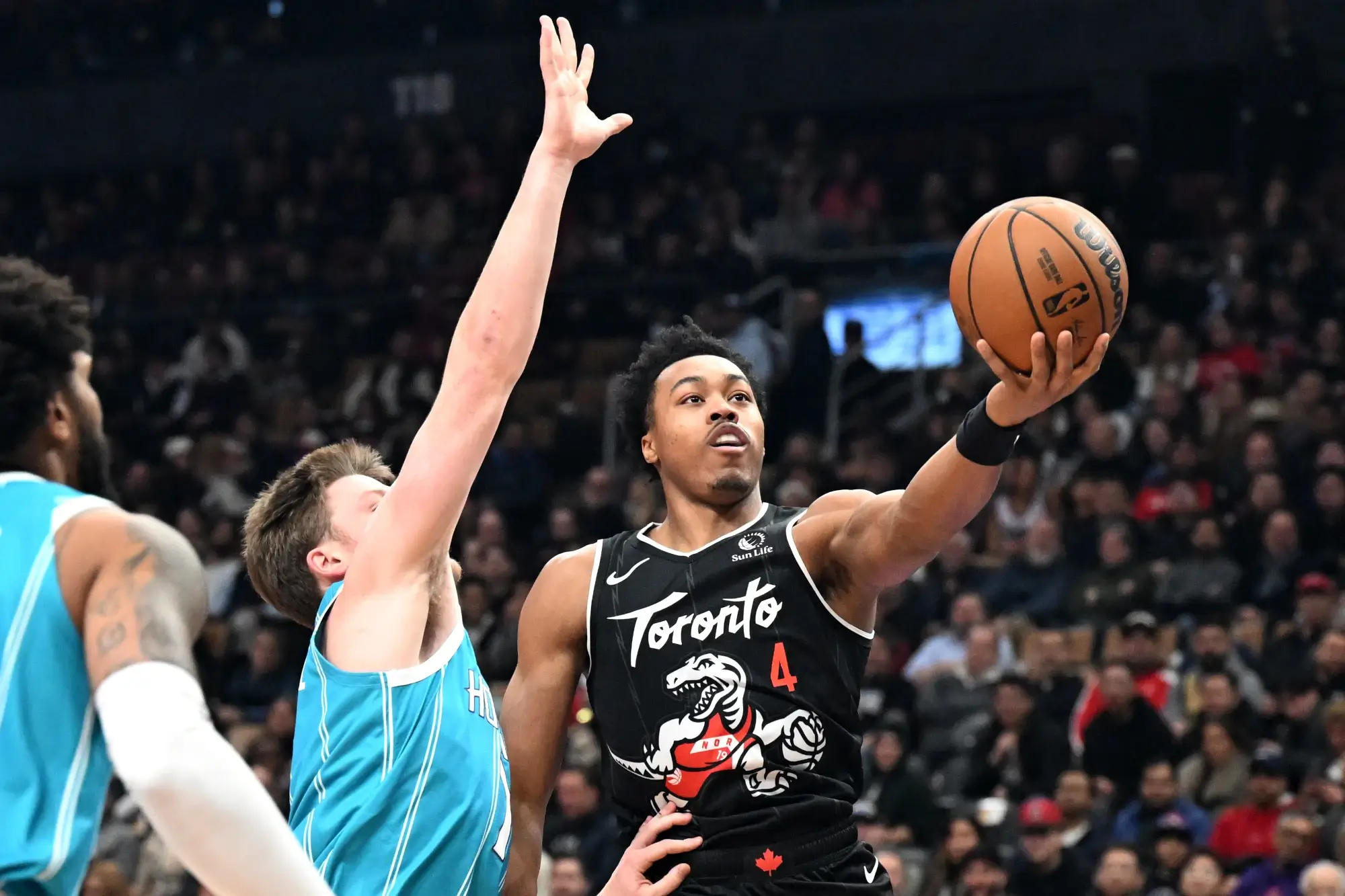 Nov 17, 2025; Toronto, Ontario, CAN; Toronto Raptors forward Scottie Barnes (4) shoots the ball against Charlotte Hornets forward Kon Kneuppel (7) in the first half at Scotiabank Arena.