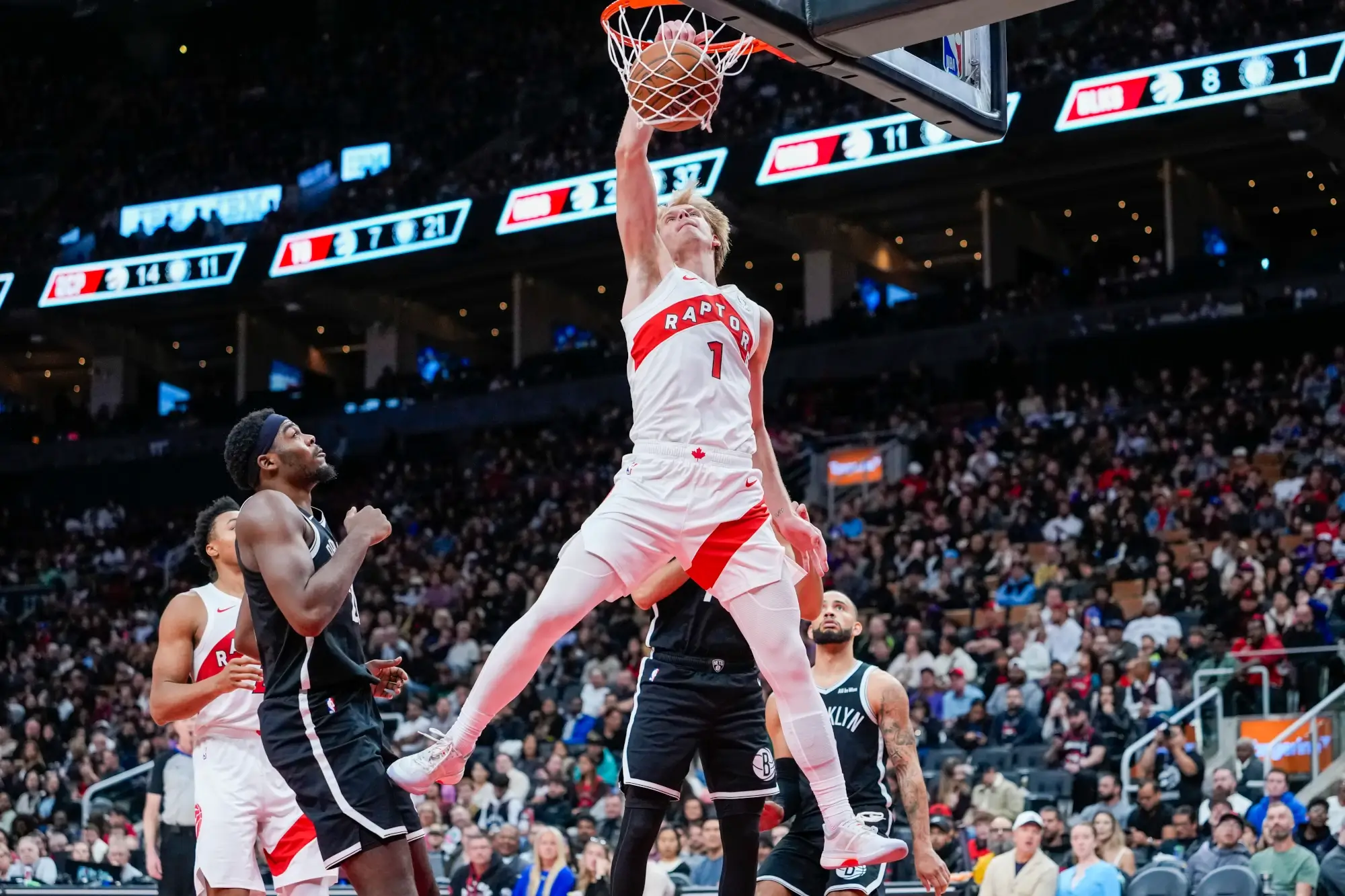 Oct 17, 2025; Toronto, Ontario, CAN; Toronto Raptors guard/forward Gradey Dick (1) dunks the ball against the Brooklyn Nets during the second half at Scotiabank Arena.