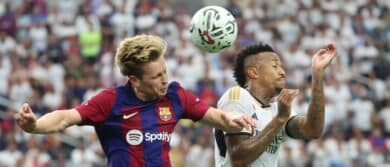 FC Barcelona midfielder Frenkie de Jong (21) and Real Madrid defender Eder Militao (3) battle for the ball during the first half at AT&T Stadium.