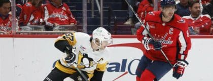 Pittsburgh Penguins center Sidney Crosby (87) and Washington Capitals left wing Alex Ovechkin (8) skate in the second period at Capital One Arena.
