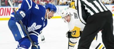 Toronto Maple Leafs center Auston Matthews (34) faces off with Pittsburgh Penguins center Sidney Crosby (87) during the second period at Scotiabank Arena