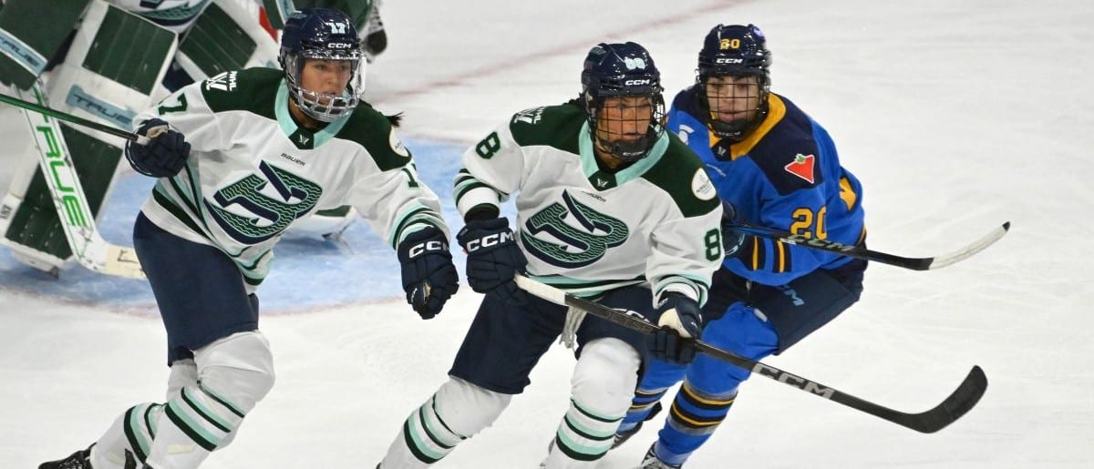 Boston Fleet forwards Lexie Adzija (88) and Taylor Girard (17) pursue the play against Toronto Sceptres forward Sarah Nurse (20) in the third period at Coca-Cola Coliseum.