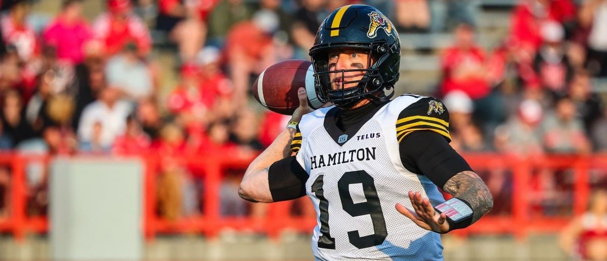 Hamilton Tiger-Cats quarterback Bo Levi Mitchell (19) looks to pass against the Calgary Stampeders during the second half at McMahon Stadium